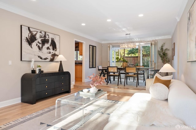 living room with a chandelier, crown molding, and wood-type flooring