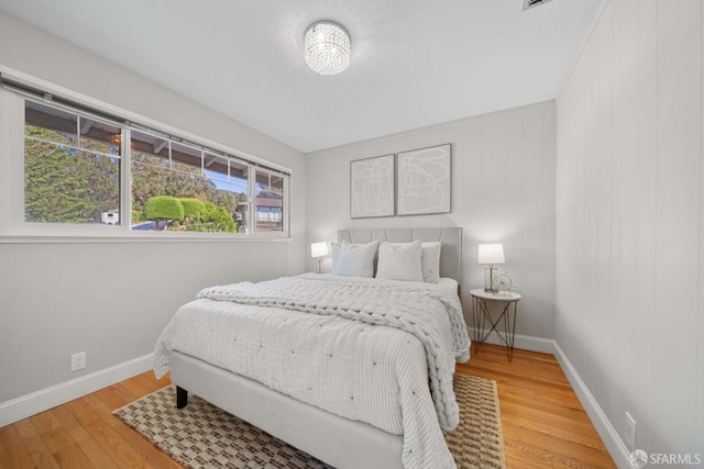 bedroom featuring wood-type flooring