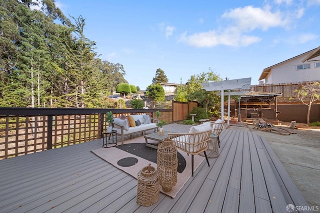 wooden terrace with an outdoor hangout area