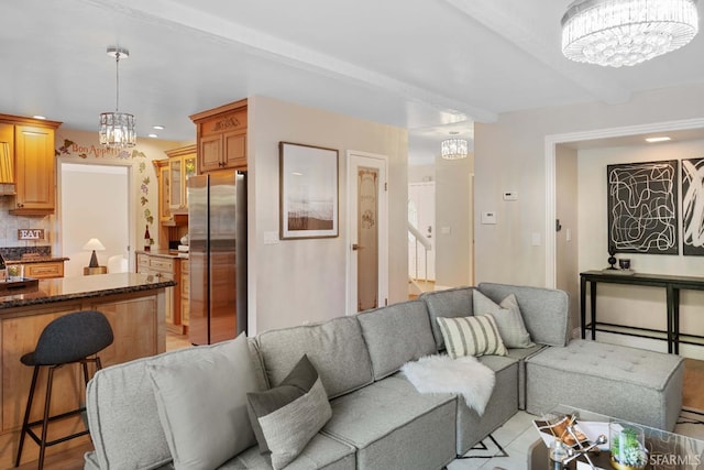 living room featuring a notable chandelier