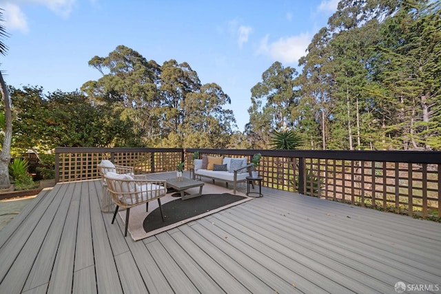 wooden terrace featuring an outdoor living space