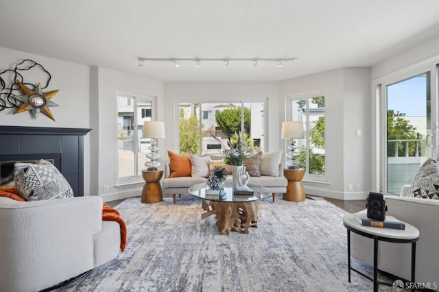 sunroom / solarium with a tiled fireplace