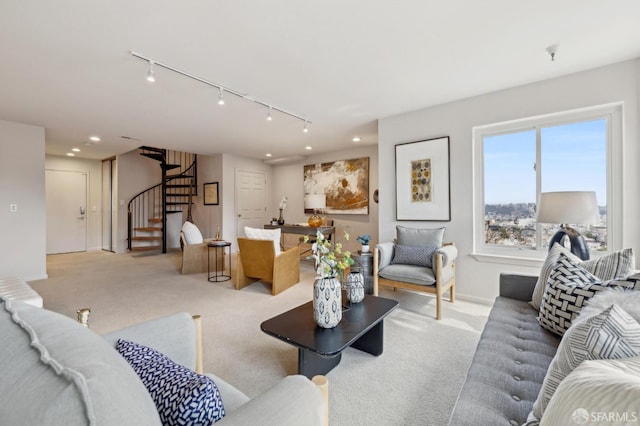 living room featuring carpet, stairway, track lighting, and recessed lighting