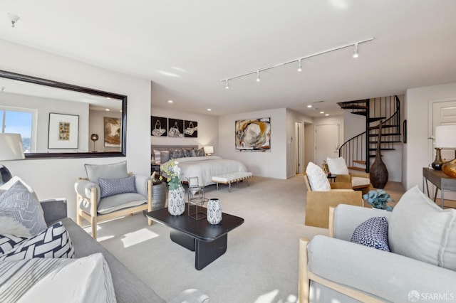 carpeted living area with recessed lighting, stairway, and track lighting