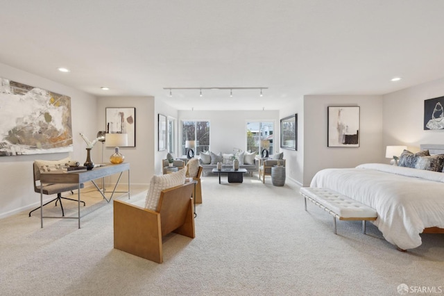 bedroom with baseboards, track lighting, carpet flooring, and recessed lighting