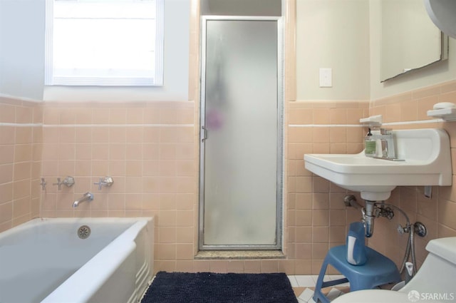 2383-2385 26th Ave, San Francisco, CA 94116 - full bathroom with tile walls, a stall shower, a bath, and a wainscoted wall