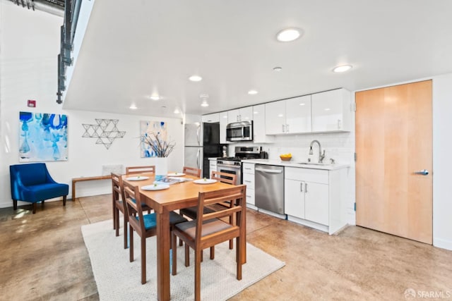 dining room featuring sink