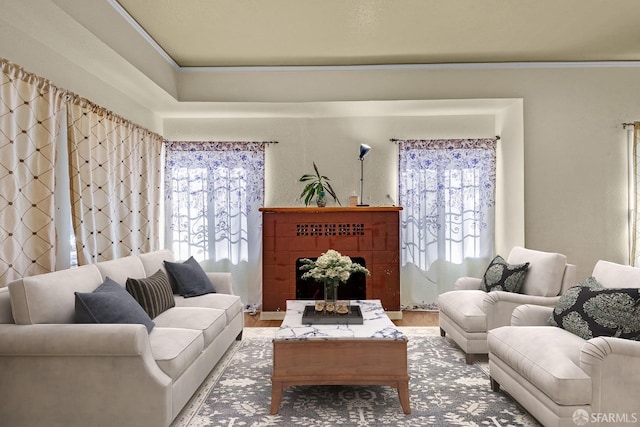 living room featuring crown molding and wood finished floors