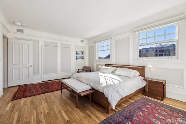 bedroom with hardwood / wood-style flooring