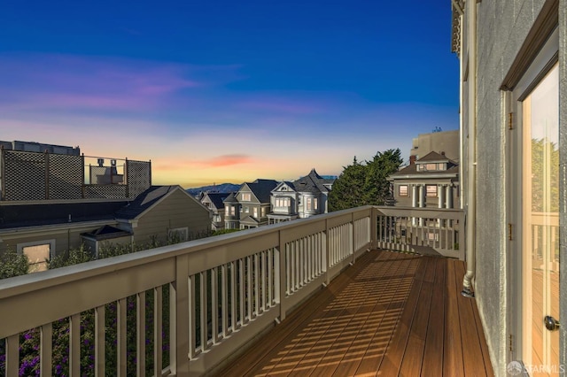 view of balcony at dusk