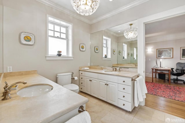 bathroom featuring vanity, a notable chandelier, crown molding, and tile patterned floors