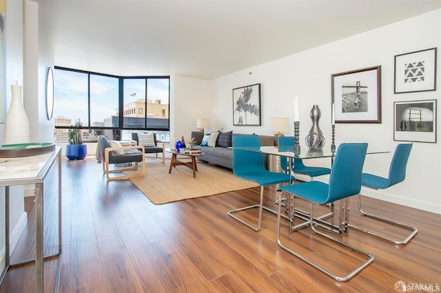 living room with floor to ceiling windows and hardwood / wood-style floors