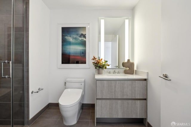 338 Main St Unit Ph36B, San Francisco, CA 94105 - bathroom featuring toilet, vanity, a shower stall, tile patterned flooring, and baseboards