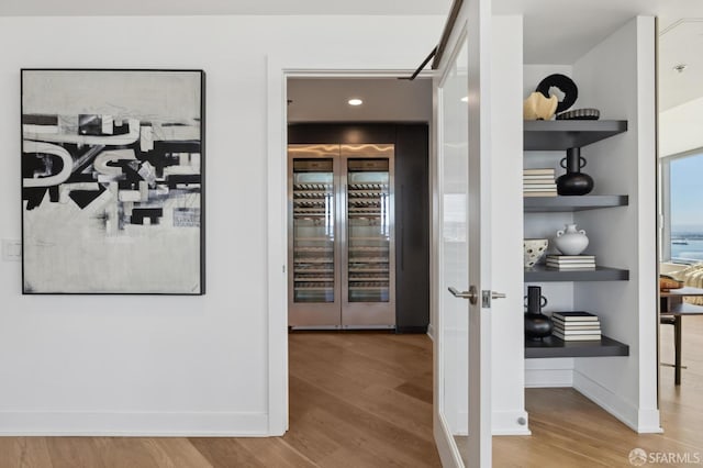 338 Main St Unit Ph36B, San Francisco, CA 94105 - corridor with wood finished floors, baseboards, and wine cooler