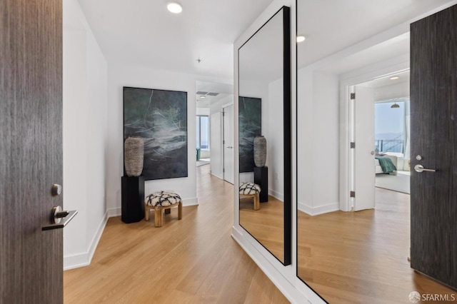338 Main St Unit Ph36B, San Francisco, CA 94105 - hallway featuring wood finished floors, plenty of natural light, and baseboards