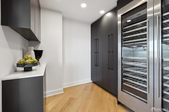 338 Main St Unit Ph36B, San Francisco, CA 94105 - hallway featuring wine cooler, baseboards, light wood-type flooring, and recessed lighting