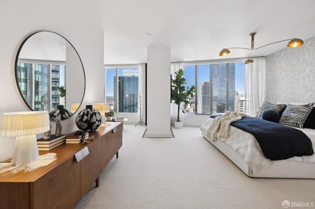 338 Main St Unit Ph36B, San Francisco, CA 94105 - bedroom featuring a view of skyline, light colored carpet, and baseboards