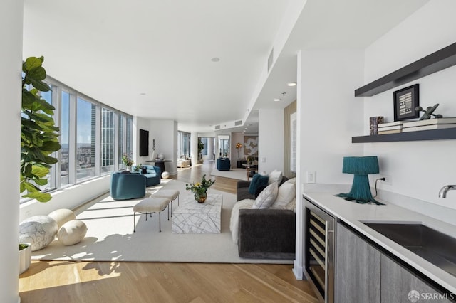 338 Main St Unit Ph36B, San Francisco, CA 94105 - living room with wine cooler and wood finished floors