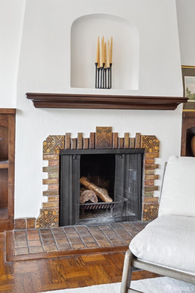 interior details featuring parquet floors and a fireplace