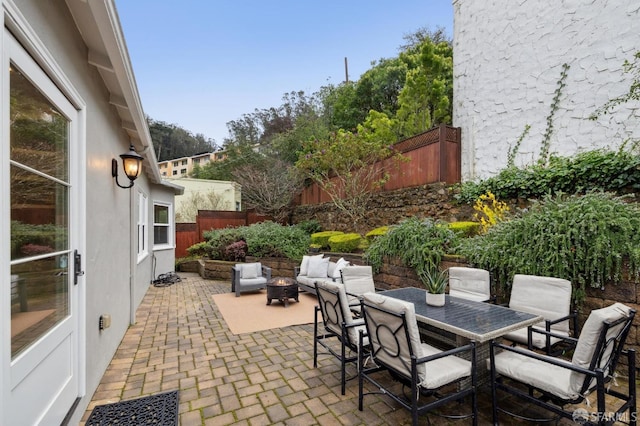 view of patio / terrace with an outdoor fire pit