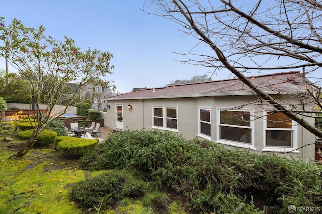 rear view of property with a patio area