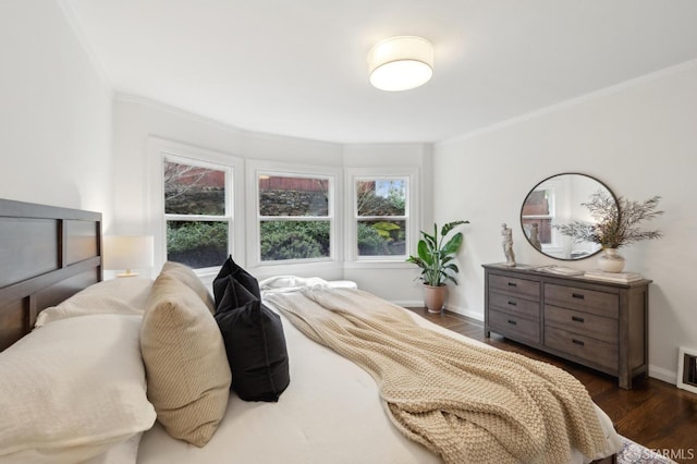 bedroom featuring dark hardwood / wood-style flooring and ornamental molding