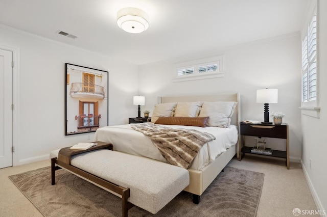 carpeted bedroom featuring ornamental molding