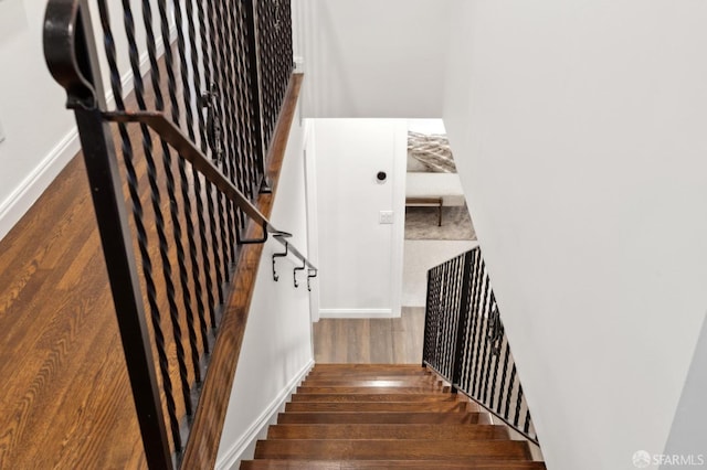 stairway featuring hardwood / wood-style floors