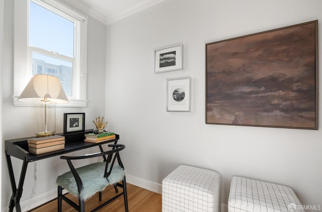 office with ornamental molding and hardwood / wood-style floors