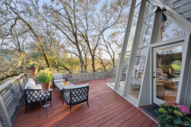wooden deck with an outdoor hangout area
