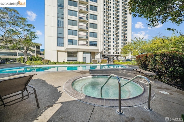 6363 Christie Ave Unit 1823, Emeryville, CA 94608 - pool featuring a patio and a hot tub