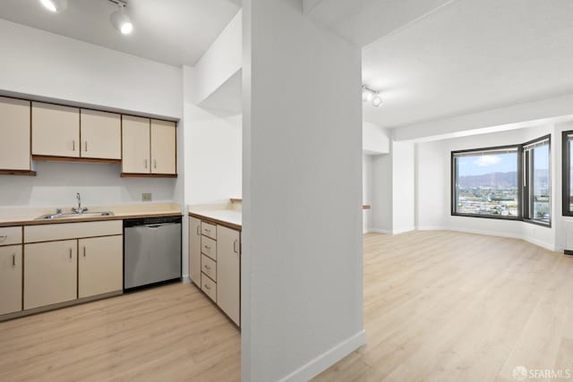 6363 Christie Ave Unit 1823, Emeryville, CA 94608 - kitchen featuring rail lighting, dishwasher, a sink, light wood finished floors, and cream cabinetry