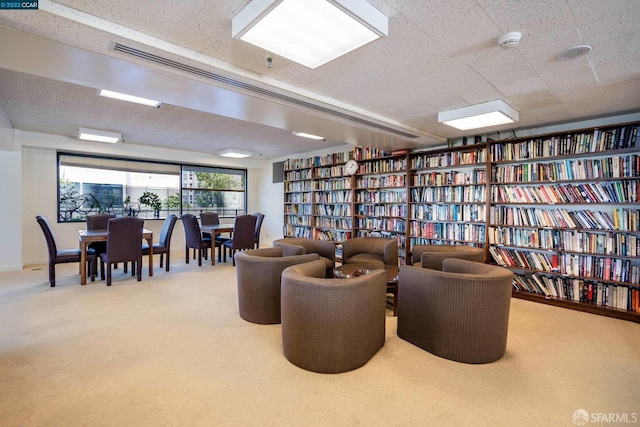 6363 Christie Ave Unit 1823, Emeryville, CA 94608 - sitting room with wall of books and carpet