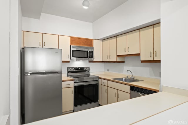 6363 Christie Ave Unit 1823, Emeryville, CA 94608 - kitchen with a sink, appliances with stainless steel finishes, cream cabinets, and light countertops