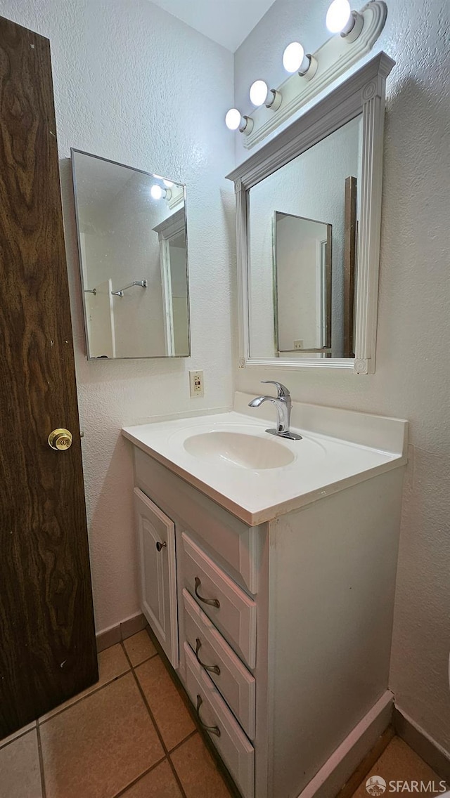 bathroom with vanity and tile patterned floors