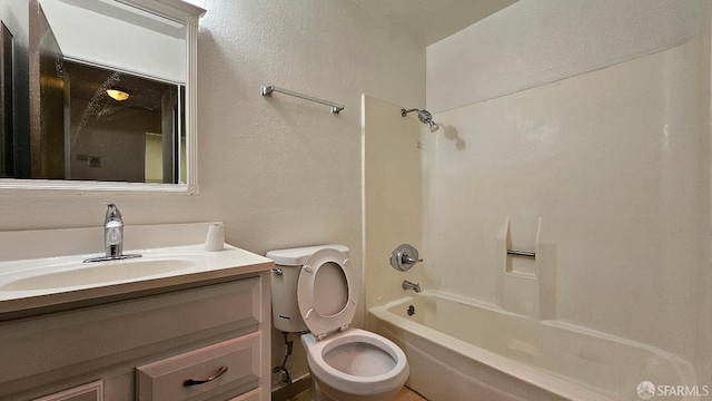 full bathroom featuring vanity, tub / shower combination, and toilet