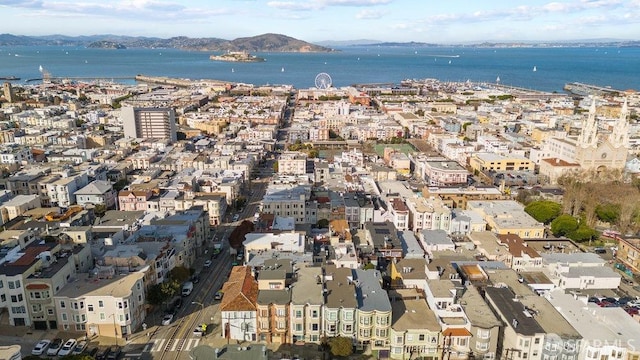 aerial view featuring a water and mountain view