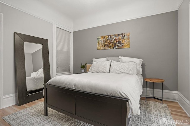 bedroom featuring hardwood / wood-style floors