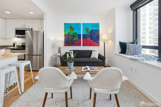 living room with light hardwood / wood-style floors