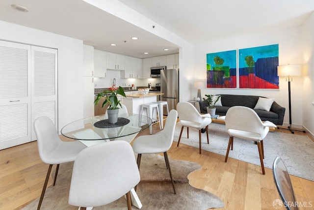 dining space featuring light hardwood / wood-style floors