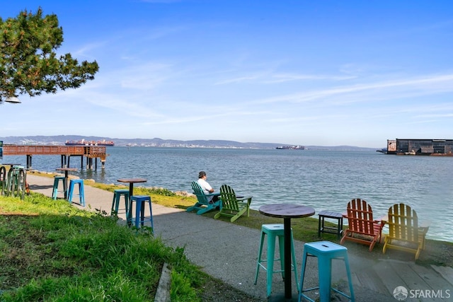 dock area featuring a water and mountain view