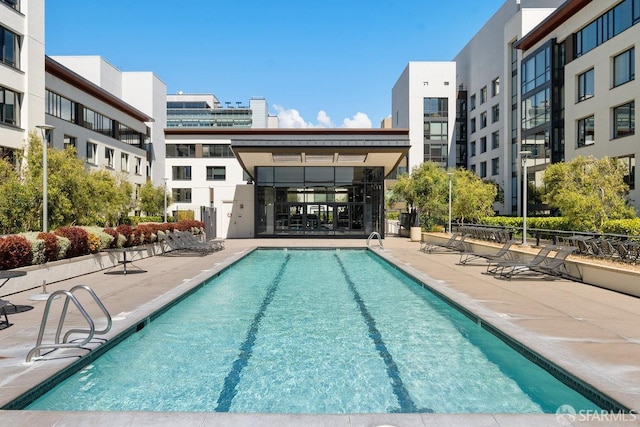 view of swimming pool featuring a patio