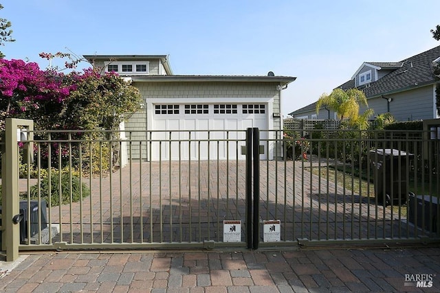 view of gate featuring fence