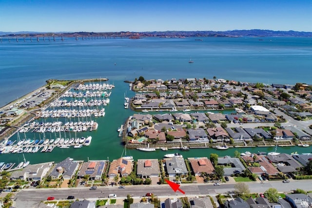 bird's eye view featuring a water view and a residential view