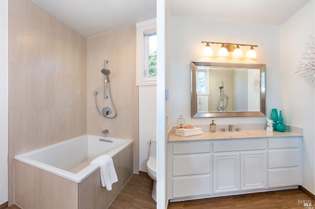 bathroom with toilet, bathtub / shower combination, and vanity