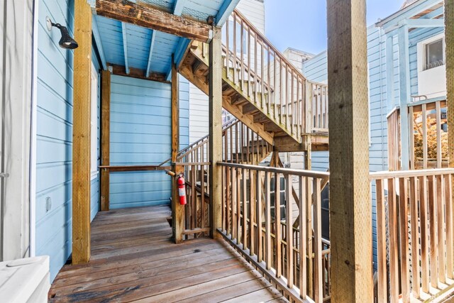 wooden terrace featuring stairs