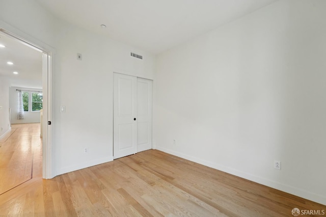 104 Diamond Cove Ter, San Francisco, CA 94134 - unfurnished bedroom with light wood-style flooring, a closet, and recessed lighting