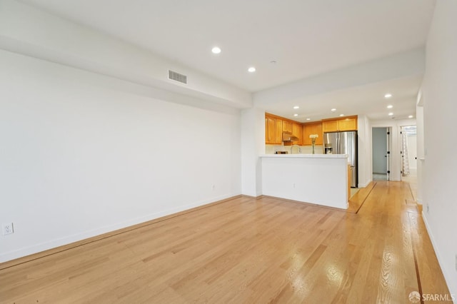 104 Diamond Cove Ter, San Francisco, CA 94134 - unfurnished living room with recessed lighting and light wood-style flooring