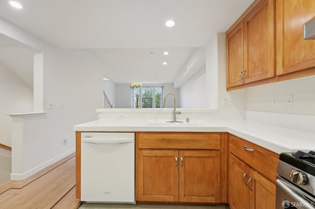 104 Diamond Cove Ter, San Francisco, CA 94134 - kitchen featuring dishwasher, a peninsula, light wood-type flooring, recessed lighting, and stainless steel range with gas stovetop