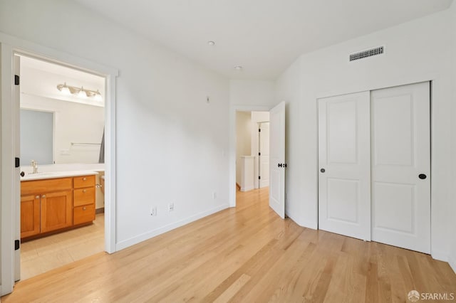 104 Diamond Cove Ter, San Francisco, CA 94134 - unfurnished bedroom with light wood-style flooring, a closet, and ensuite bathroom